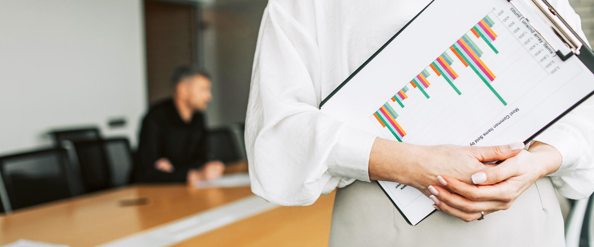Woman holding Clipboard with Chart Woman holding Clipboard with Chart